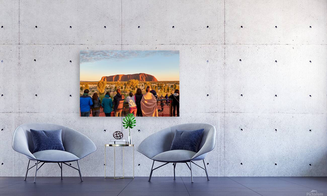 Tourists watch Uluru glow at sunrise. Reproduction