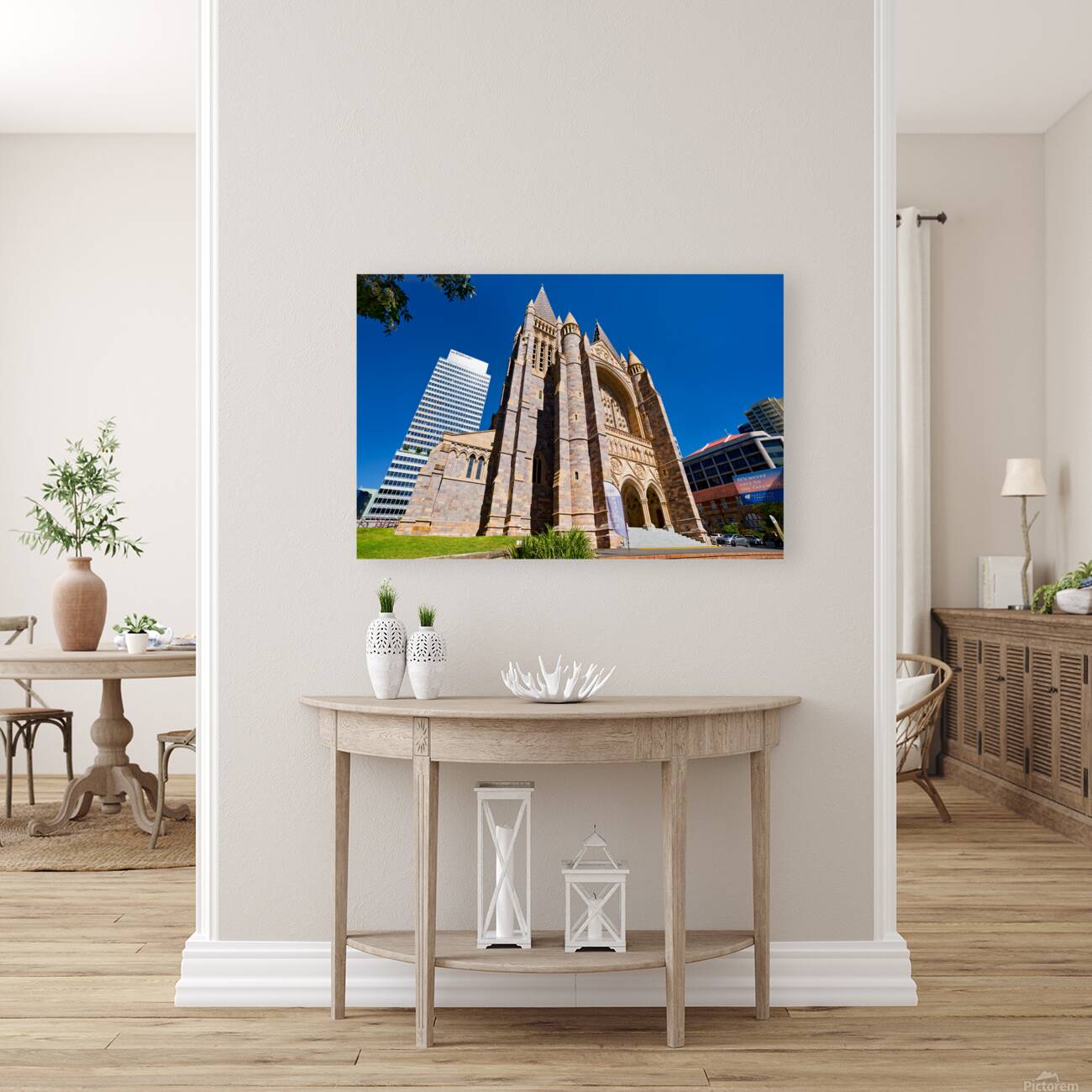 Historic church stands tall next to modern skyscrapers. Reproduction