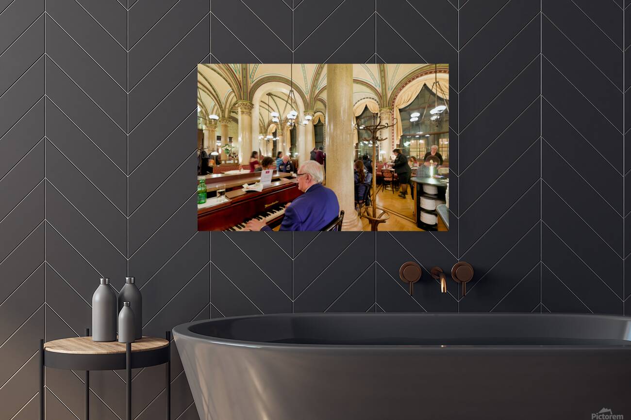 Man playing piano in an ornate bustling cafe. Reproduction