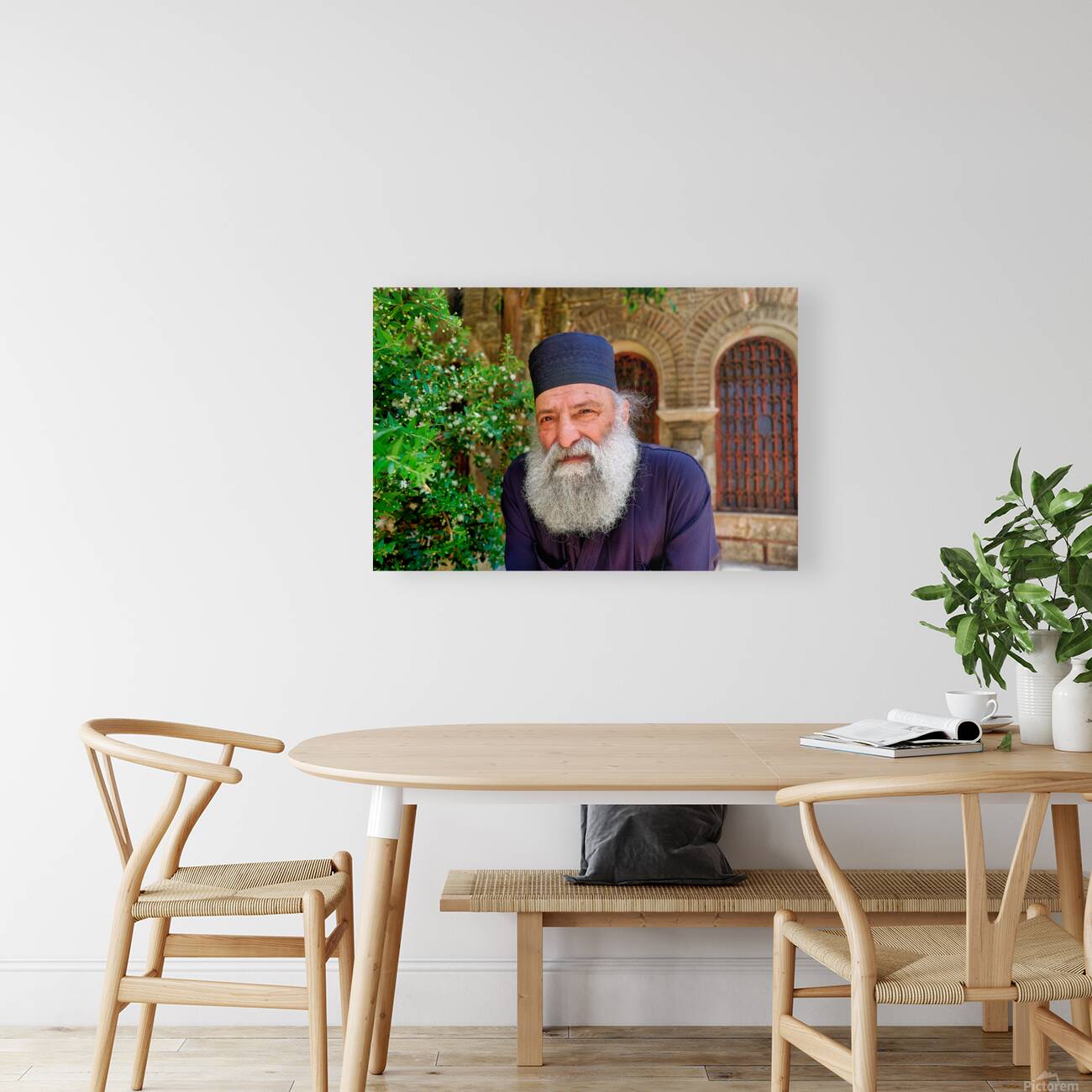 Elderly man with a beard poses near a historical building in a g Reproduction