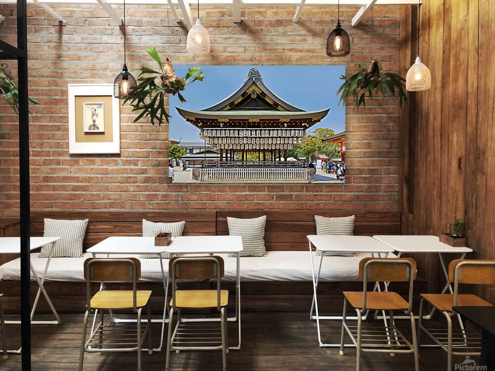 Visitors admire Yasaka shrine in Kyoto during sunny day Reproduction