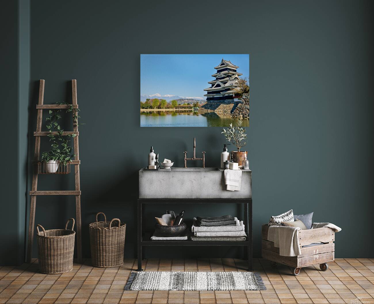 Matsumoto Castle stands beside water with mountains in the dista Reproduction