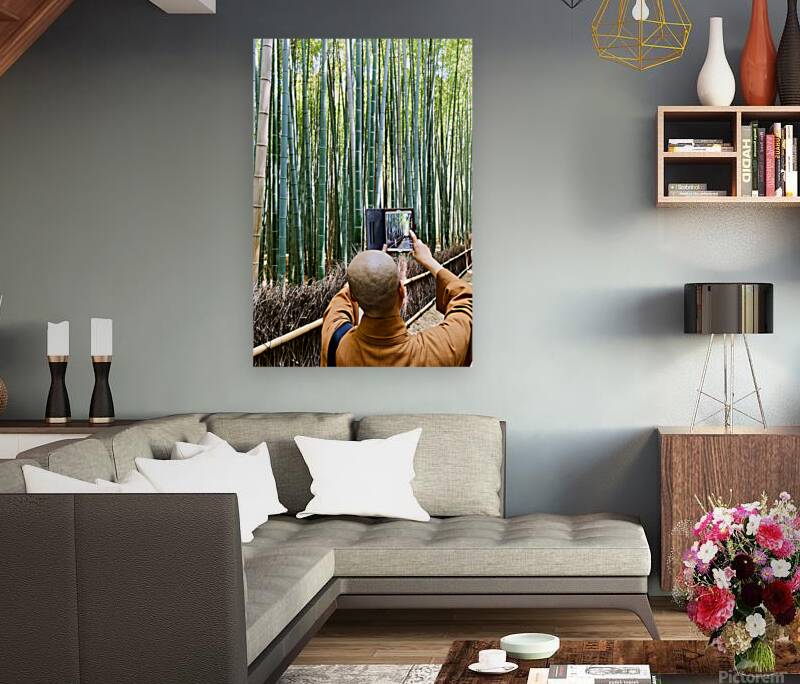 Buddhist monk takes pictures in Arashiyama Bamboo Grove in Japan Reproduction