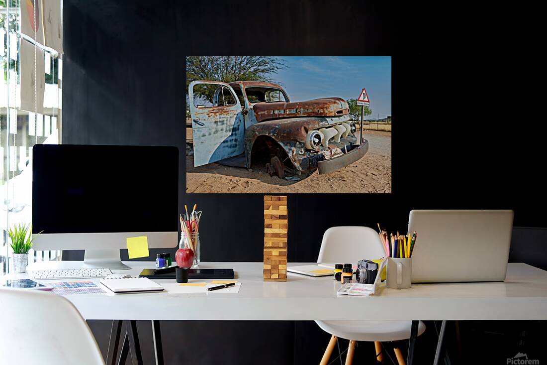 Classic car wreck in Namibias desert environment Reproduction
