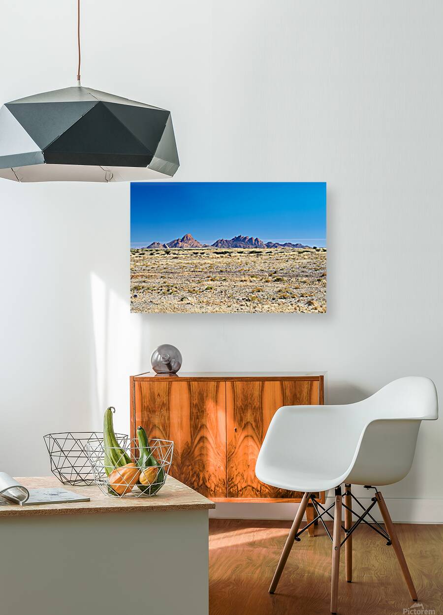 Granite peaks of Spizkoppe rise in Namib Desert landscape Reproduction