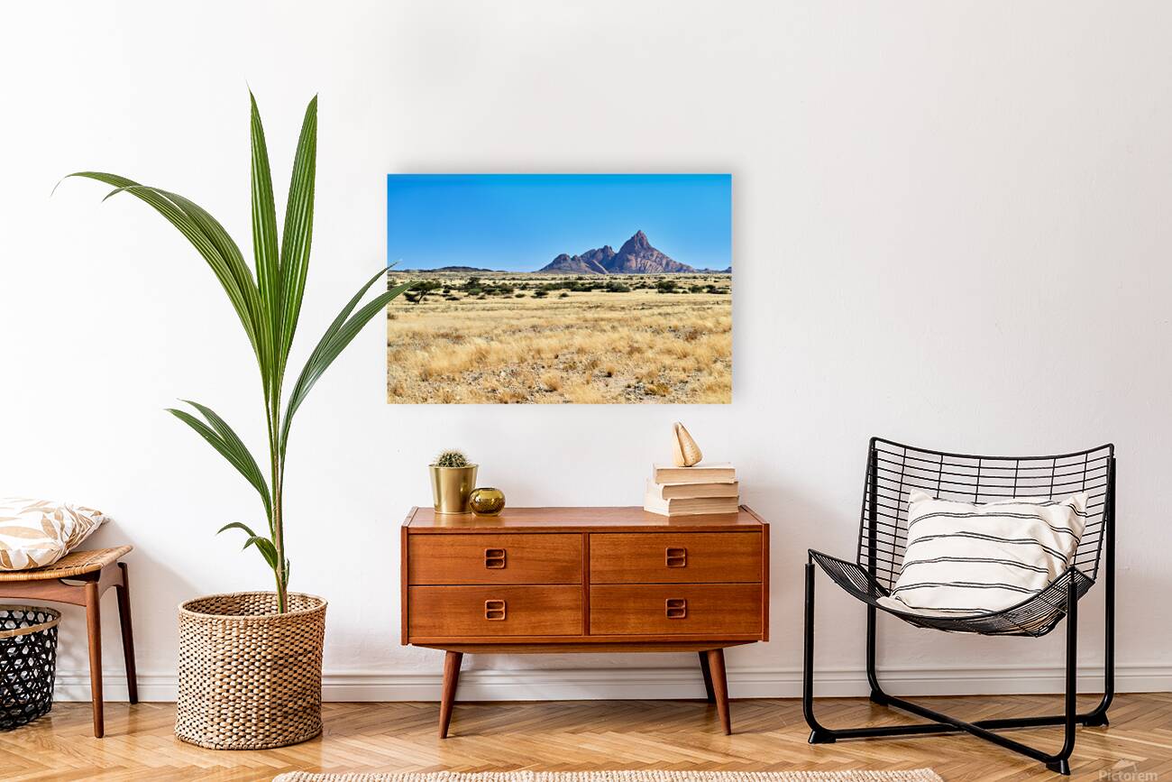 Granite peaks of Spizkoppe rise above the Namib Desert in Namibi Reproduction