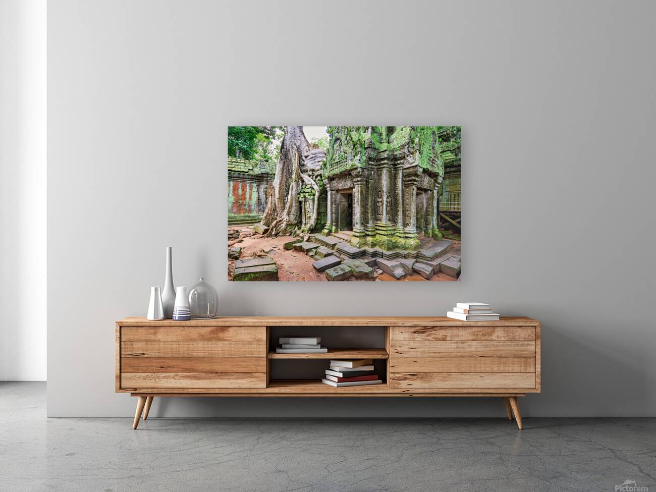 Ancient temple ruins overgrown by massive tree roots and moss. Reproduction