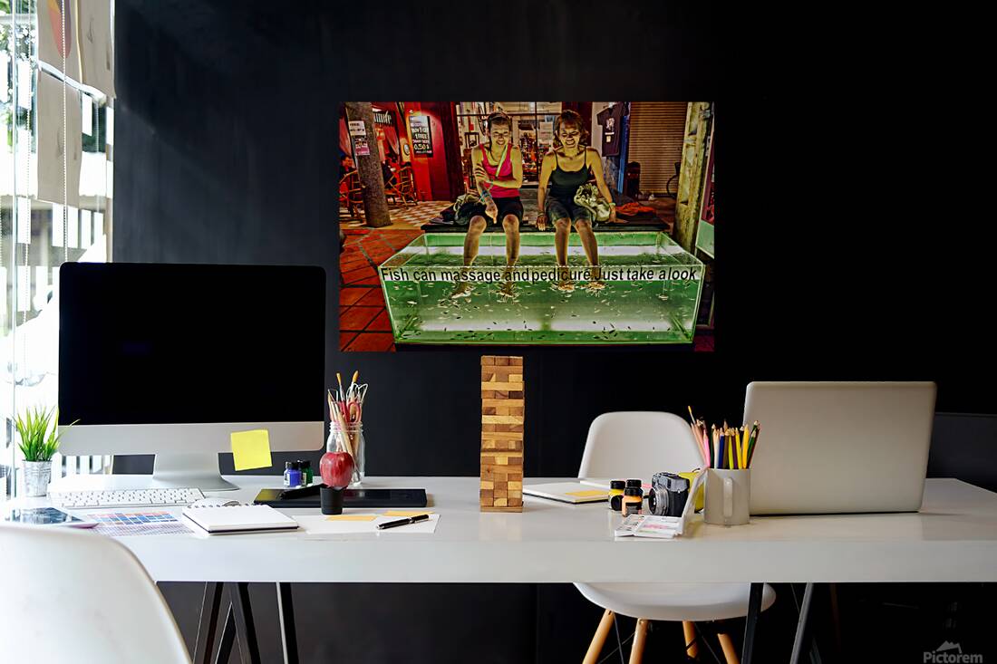 Smiling women enjoy fish foot spa. Reproduction