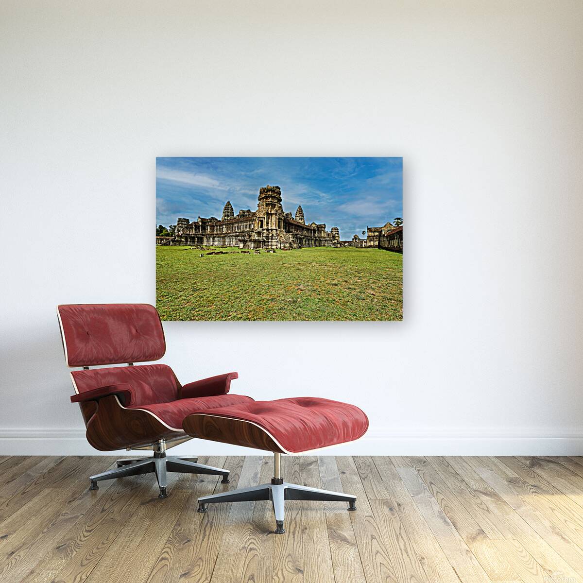 Angkor Wat temple complex with green grass and blue sky. Reproduction