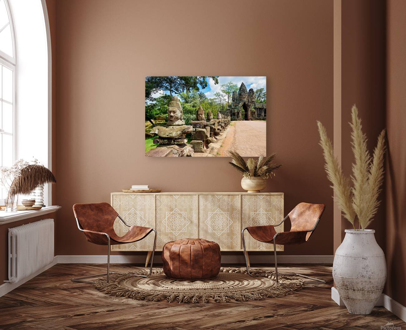 Ancient stone statues line path to Angkor Thom gate. Reproduction