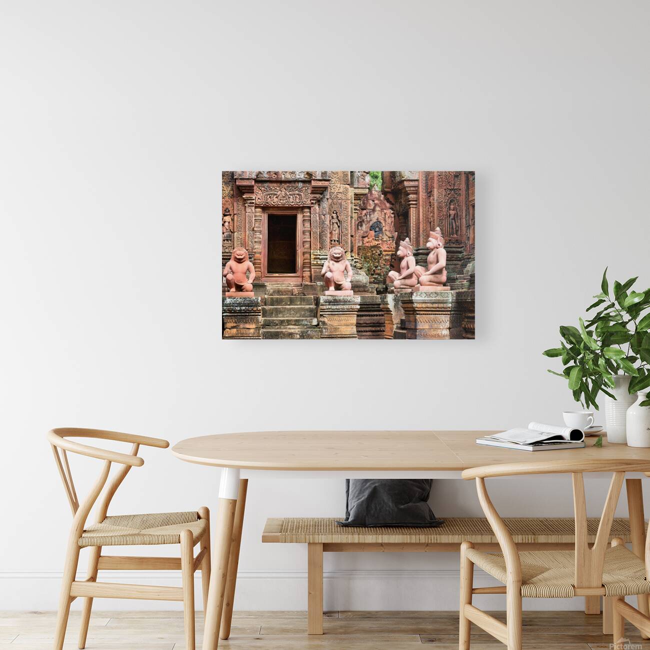 Ancient Cambodian temple with intricate red sandstone carvings a Reproduction