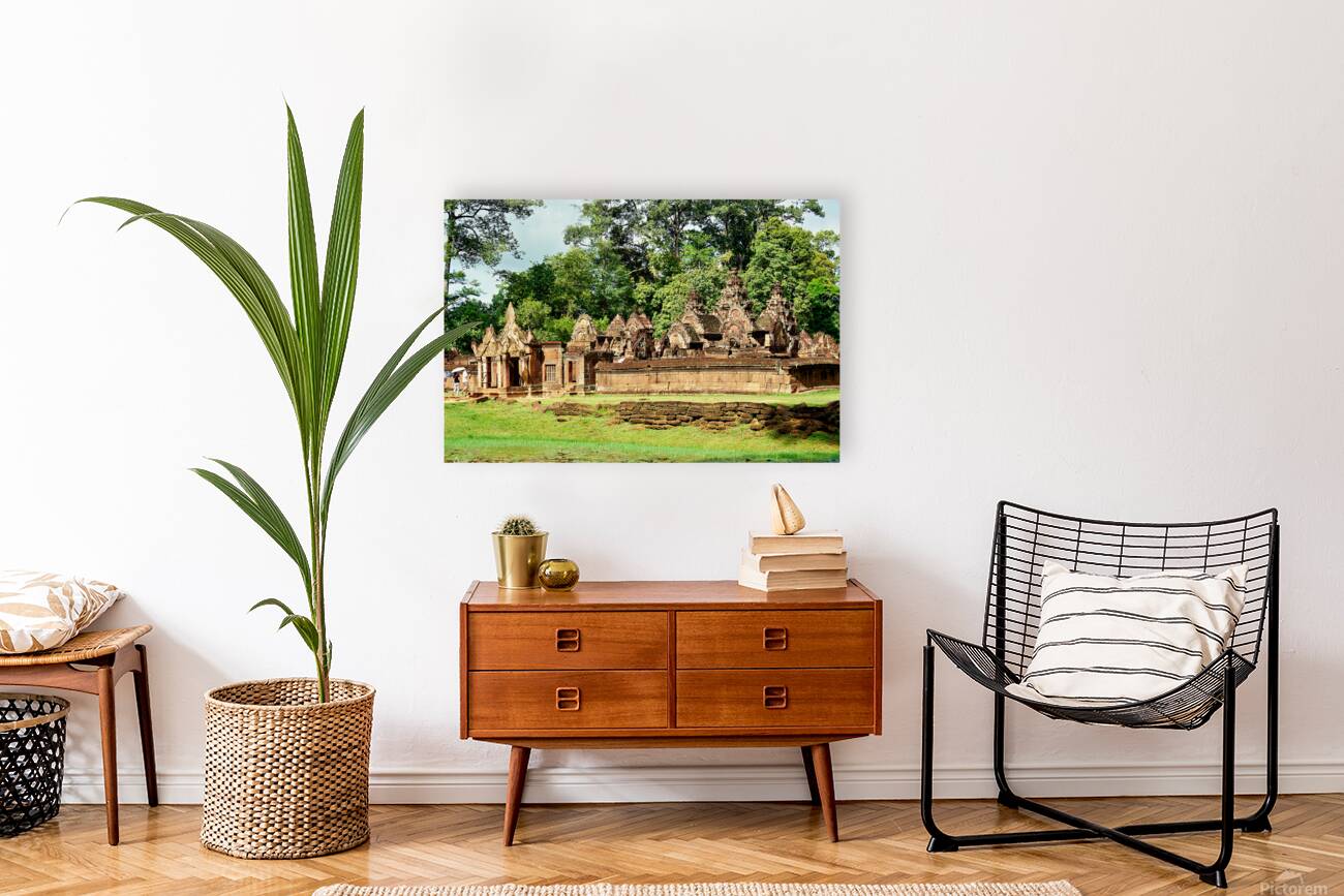 Ancient stone temple complex surrounded by lush jungle and water Reproduction