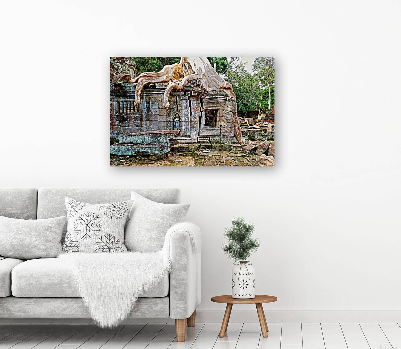 Massive tree roots engulf ancient stone temple ruins. Reproduction