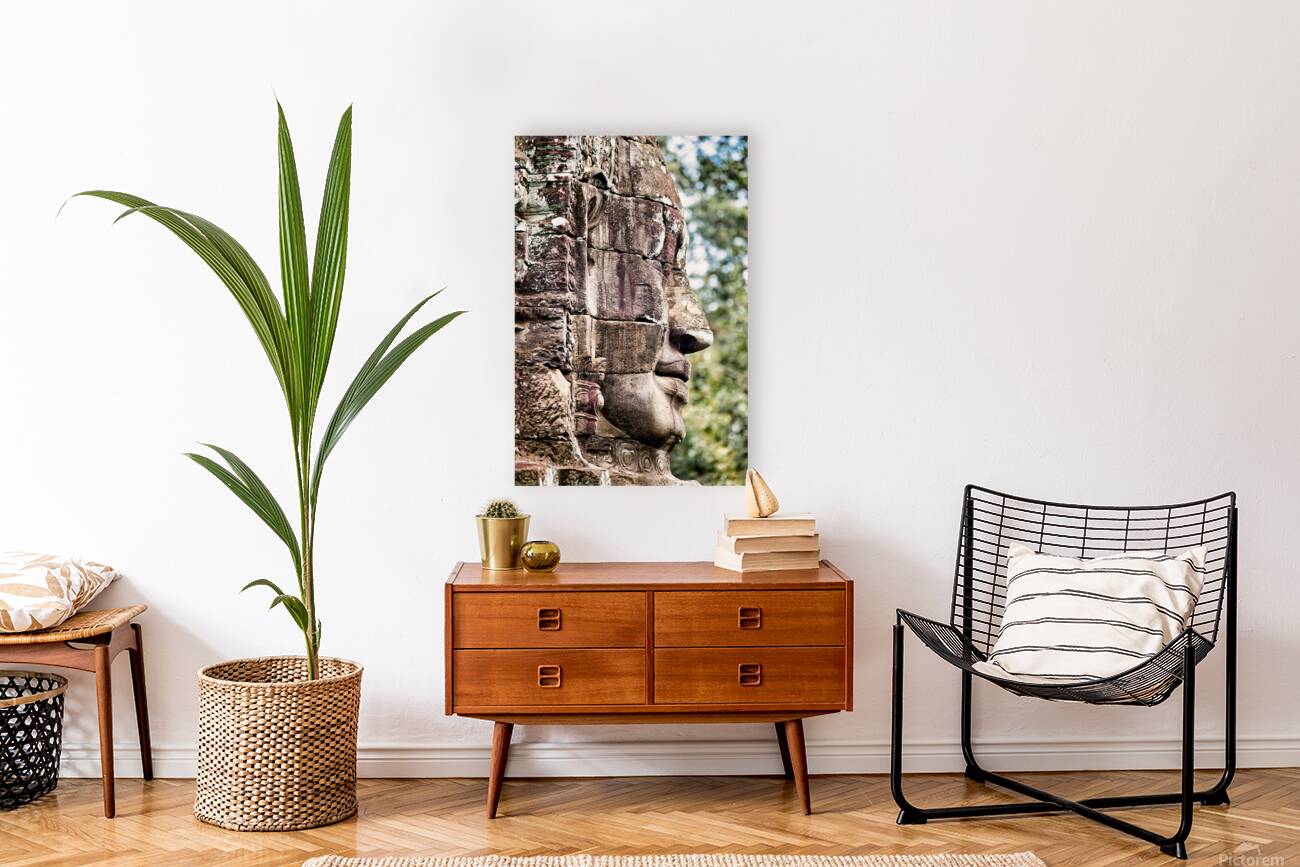 Weathered stone face carving from an ancient temple. Reproduction