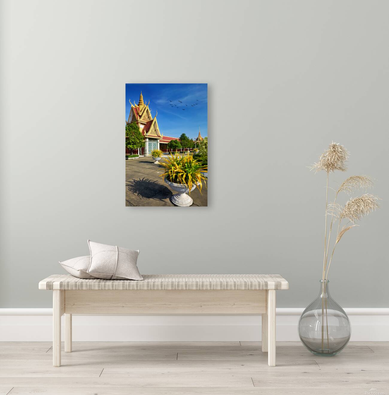 Golden temple green trees and birds under a blue sky. Reproduction