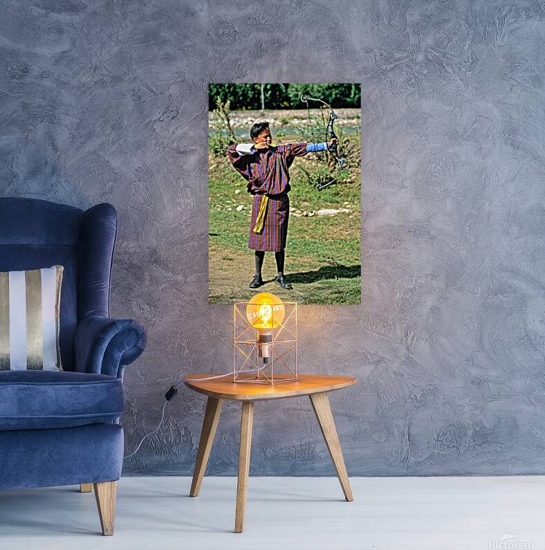 Bhutanese archer in traditional Gho aiming a compound bow. Reproduction