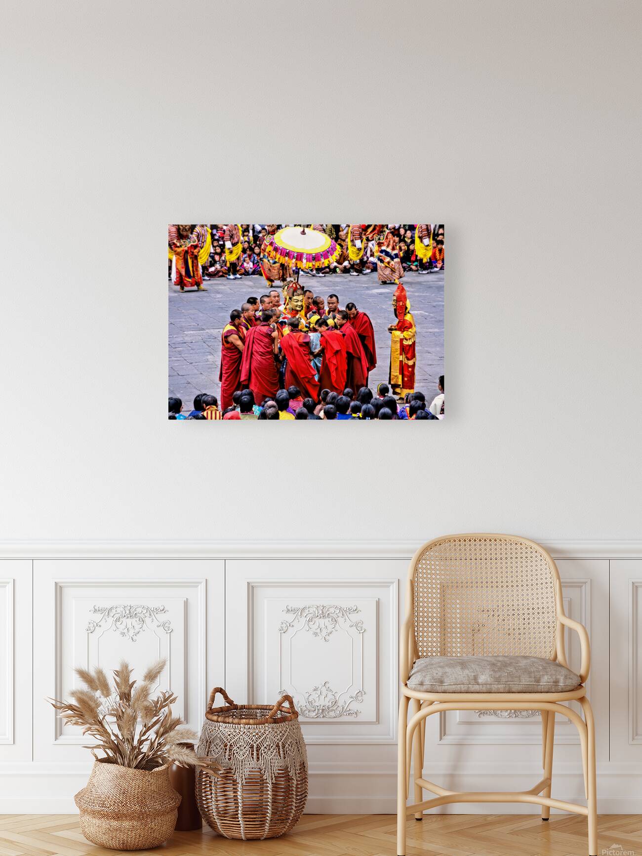 Monks in red robes gathered around a golden statue. Reproduction
