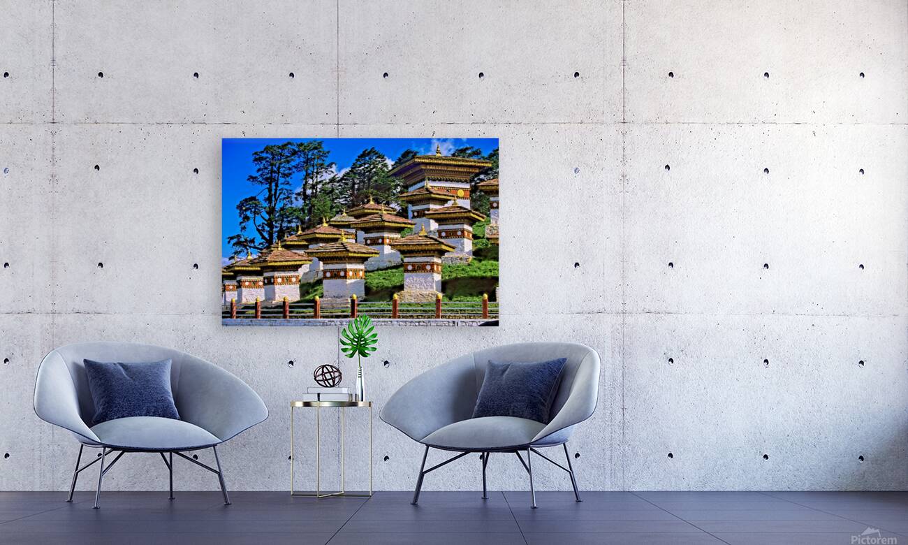 Druk Wangyal Chortens Bhutan with lush trees and blue sky. Reproduction