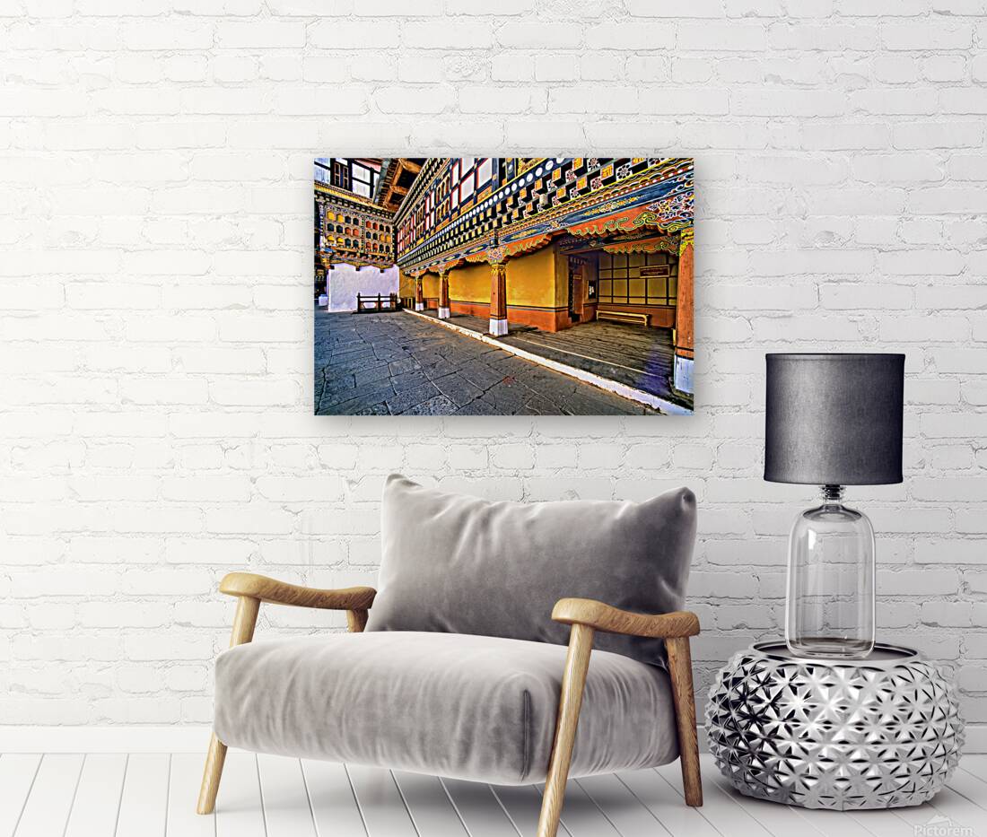 Vibrant ornate Bhutanese temple architecture and stone courtyar Reproduction