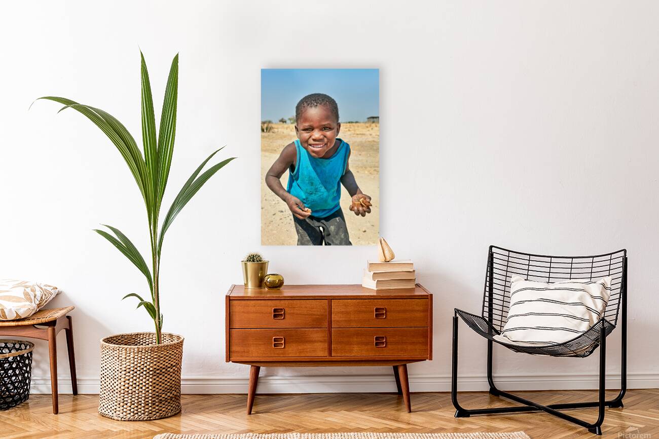 Joyful boy in Kavango Region of Namibia enjoys a moment outside Reproduction