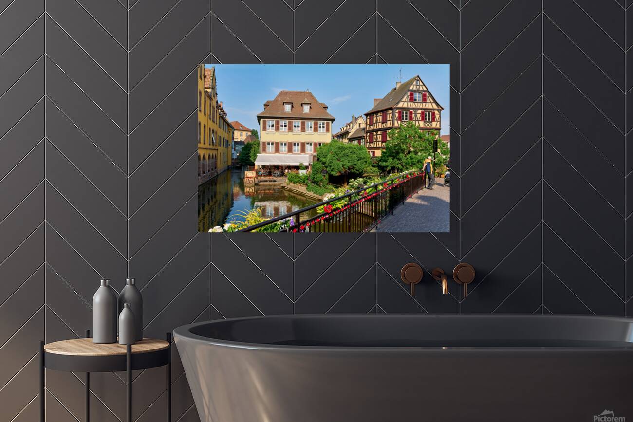 Visitors stroll by timber framed houses along the canal in Colma Reproduction