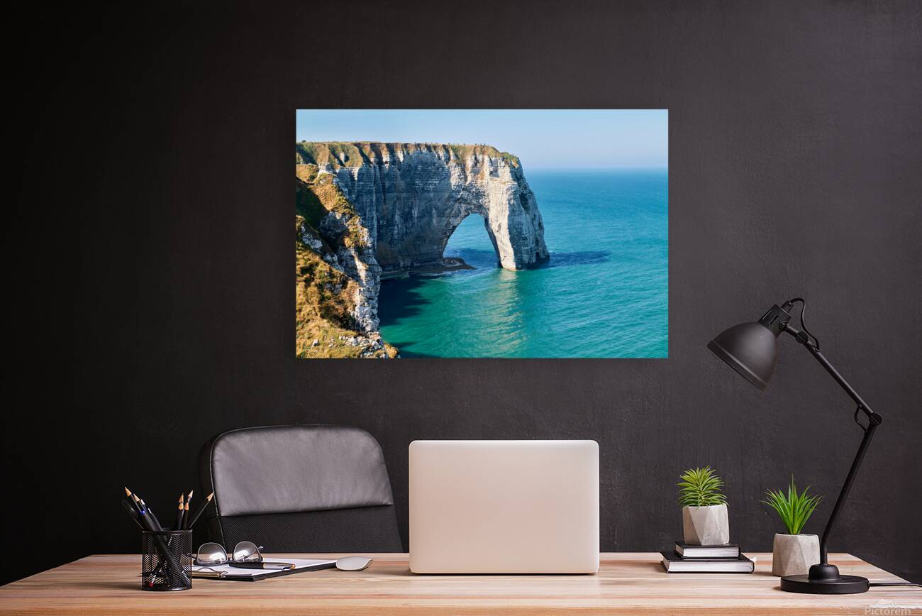Chalk cliffs of Etretat along the coast of Normandy in France Reproduction