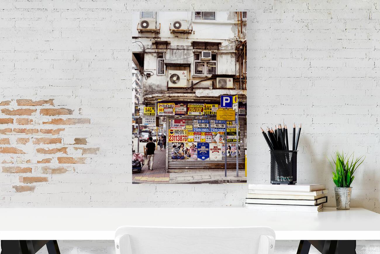 Busy street in Hong Kong shows old building and pedestrians Reproduction