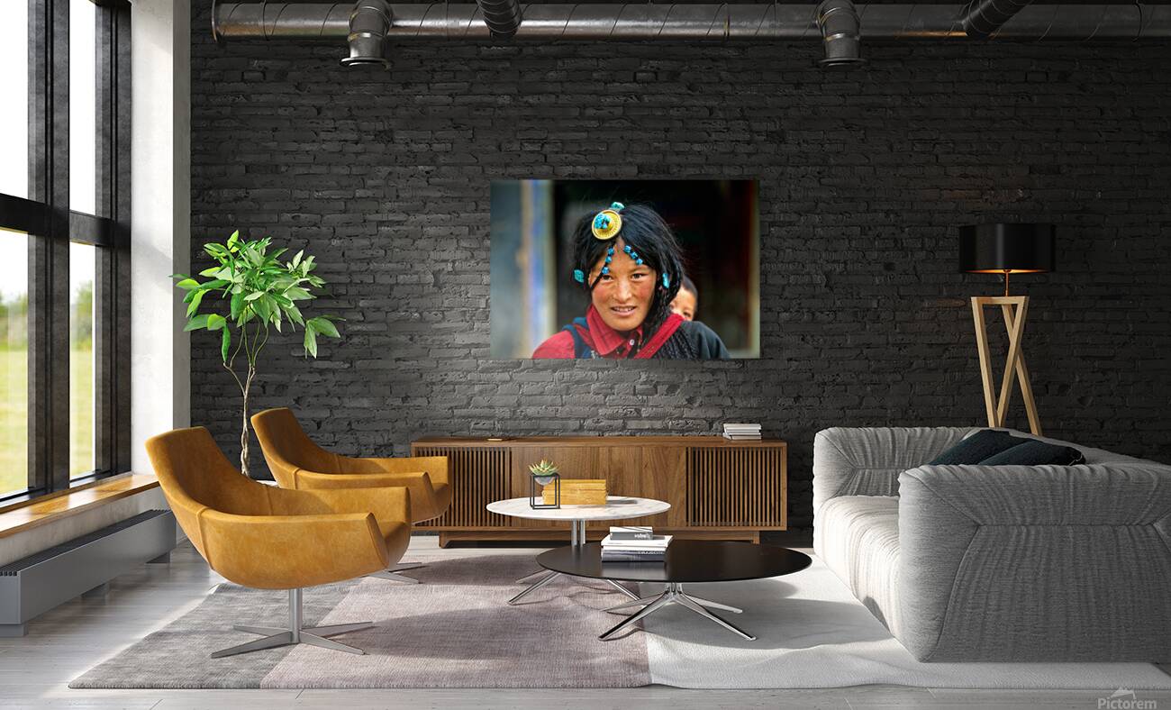 Traditional woman carries child in Tibet with ornate hair decora Reproduction