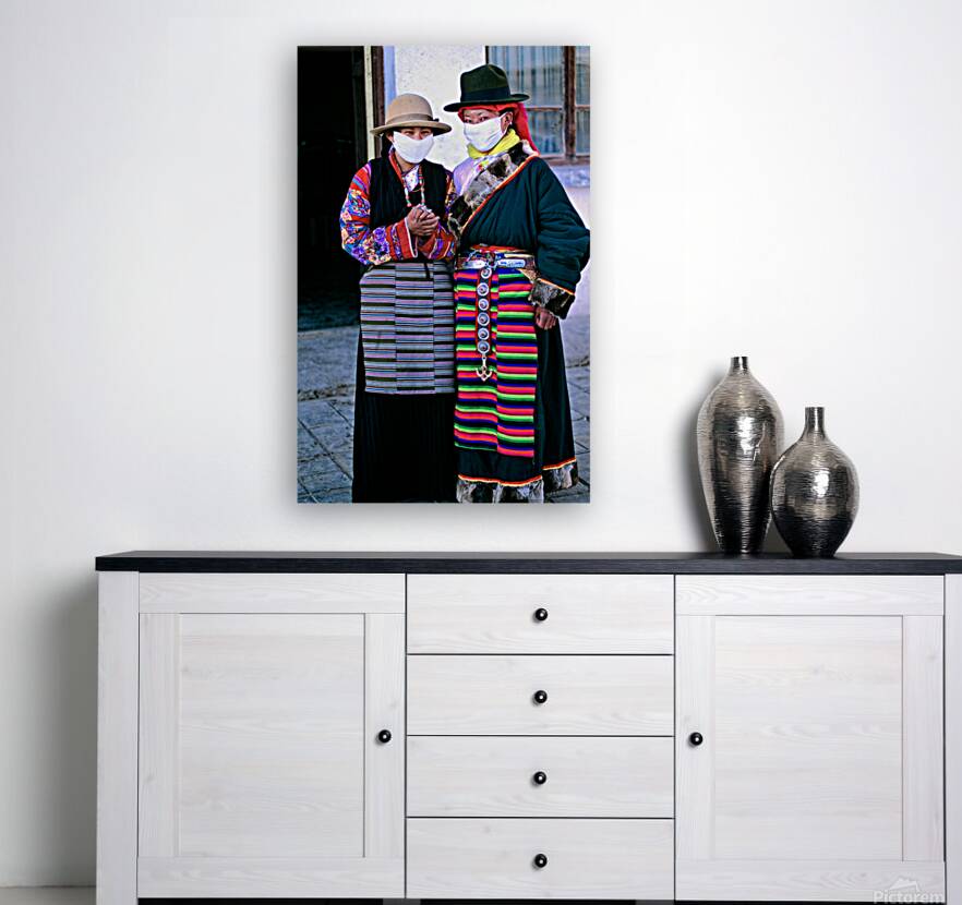 Masked individuals in traditional clothing hold hands in Tibet Reproduction