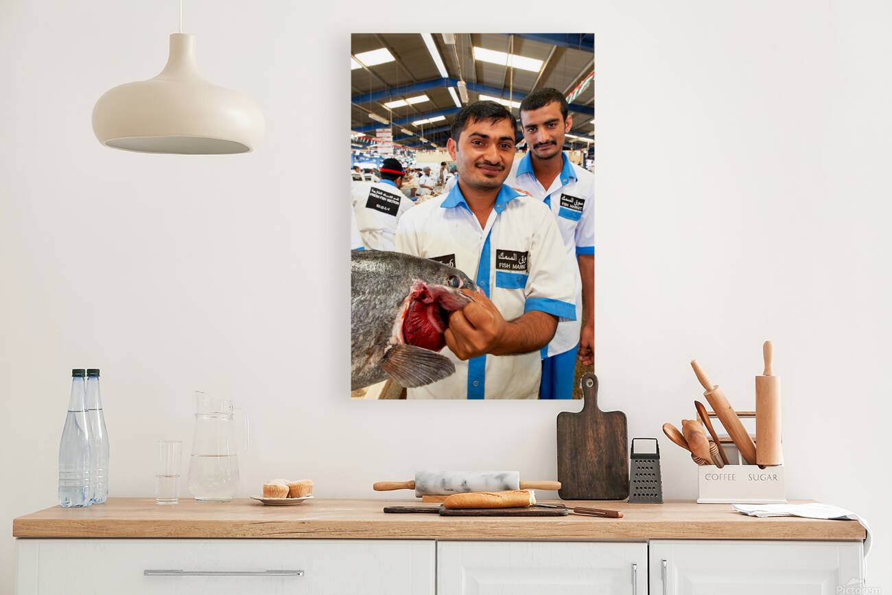 Smiling fishmongers hold fresh fish at market in Dubai UAE Reproduction