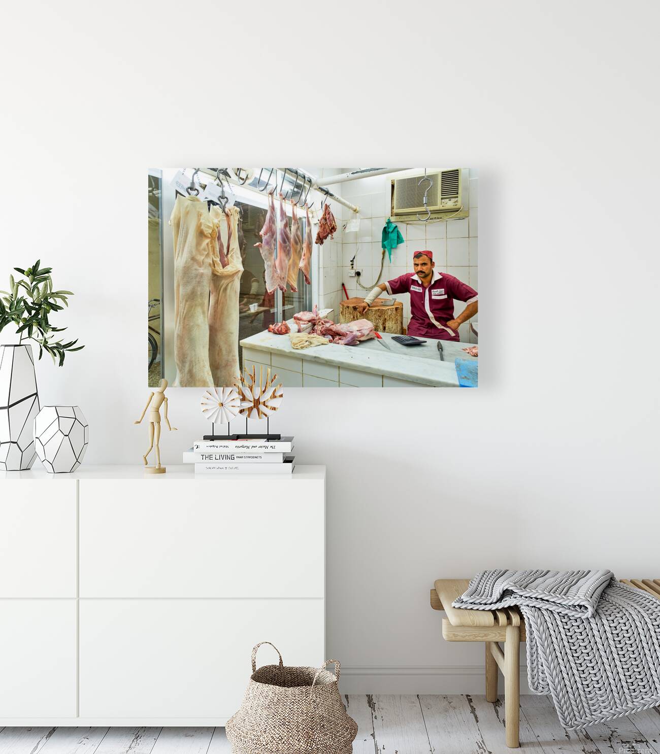 Butcher works in meat market in Dubai with hanging meat Reproduction