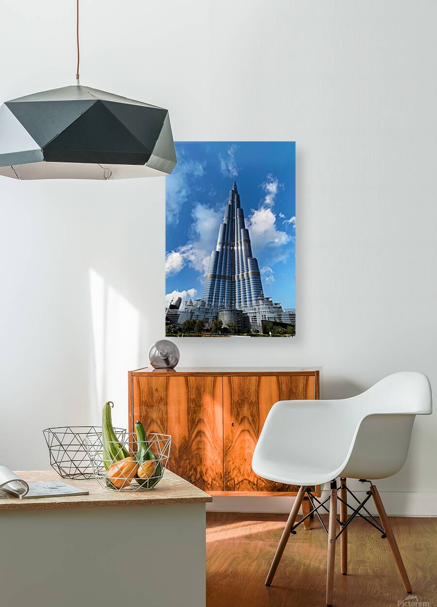 Burj Khalifa stands tall against a blue sky in Dubai UAE Reproduction