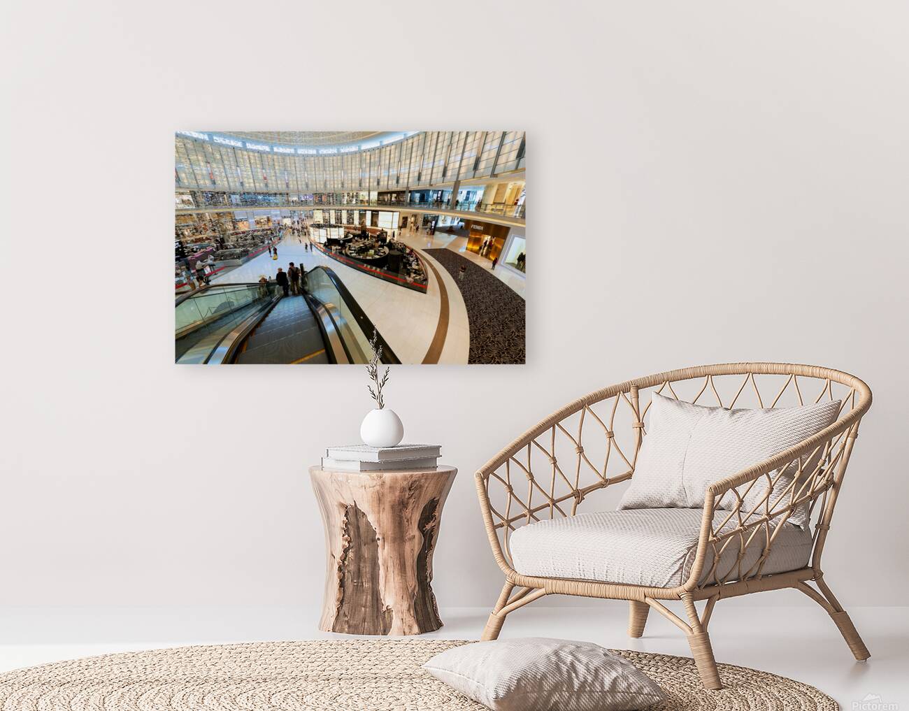 Busy shopping mall in Dubai with escalators and various stores Reproduction