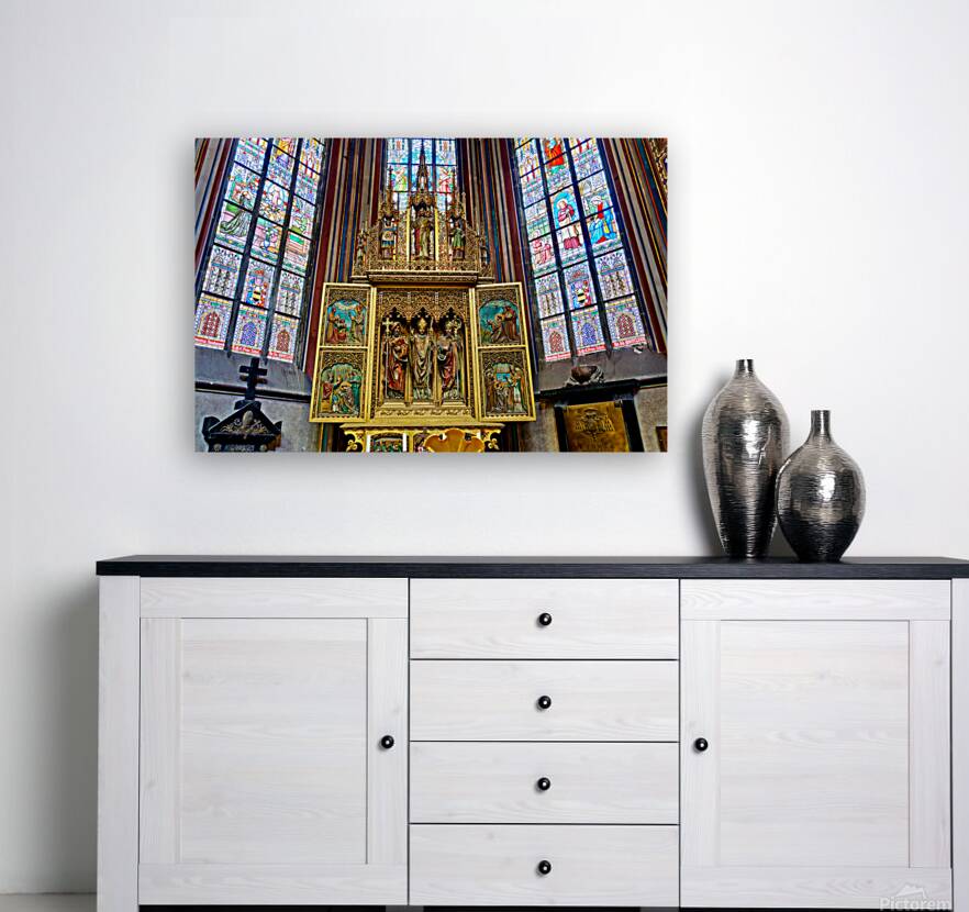 Ornate golden altarpiece and vibrant stained glass windows in a  Reproduction
