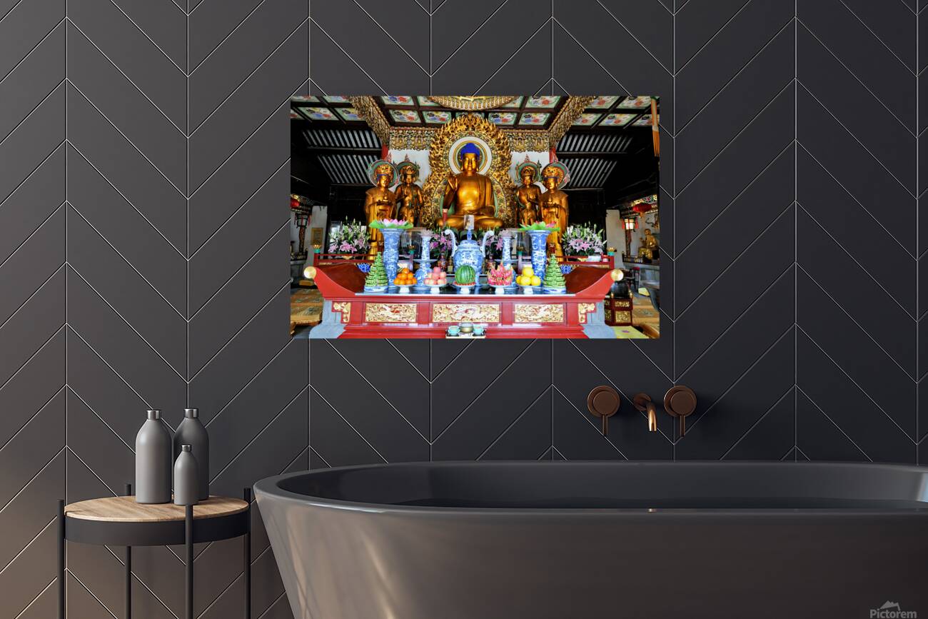 Visitors observe golden statues in Shanghai Buddhist temple inte Reproduction