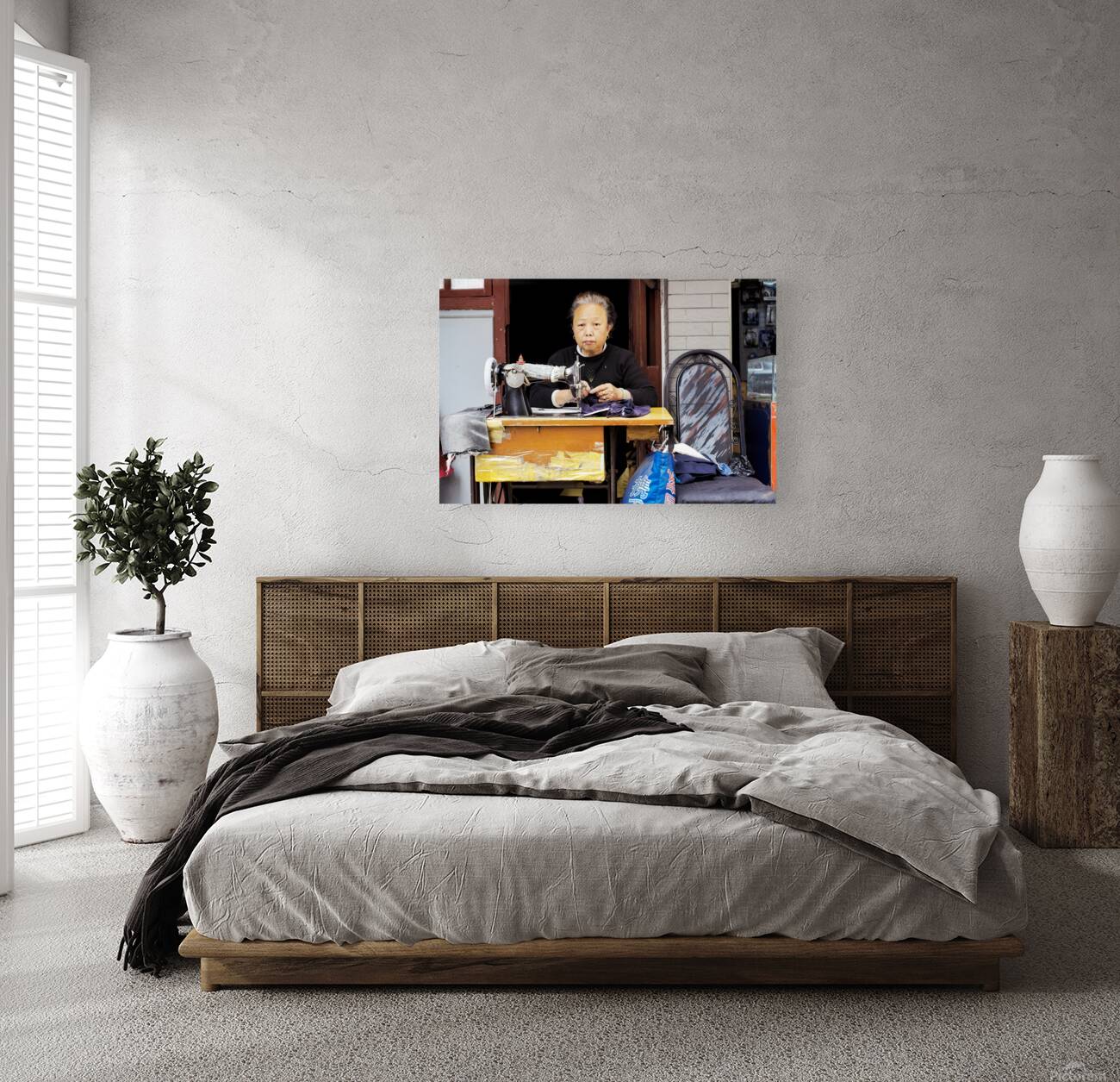 Elderly woman sews at machine in Shanghai China Reproduction