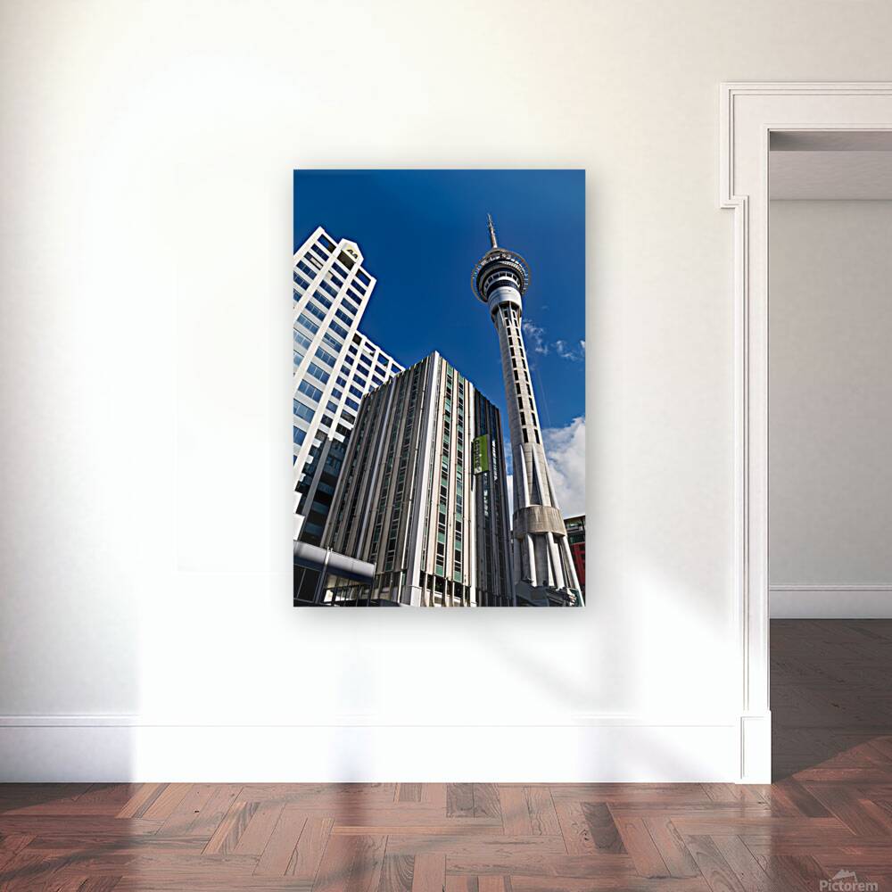 Sky Tower in Auckland showing city buildings and clear sky Reproduction