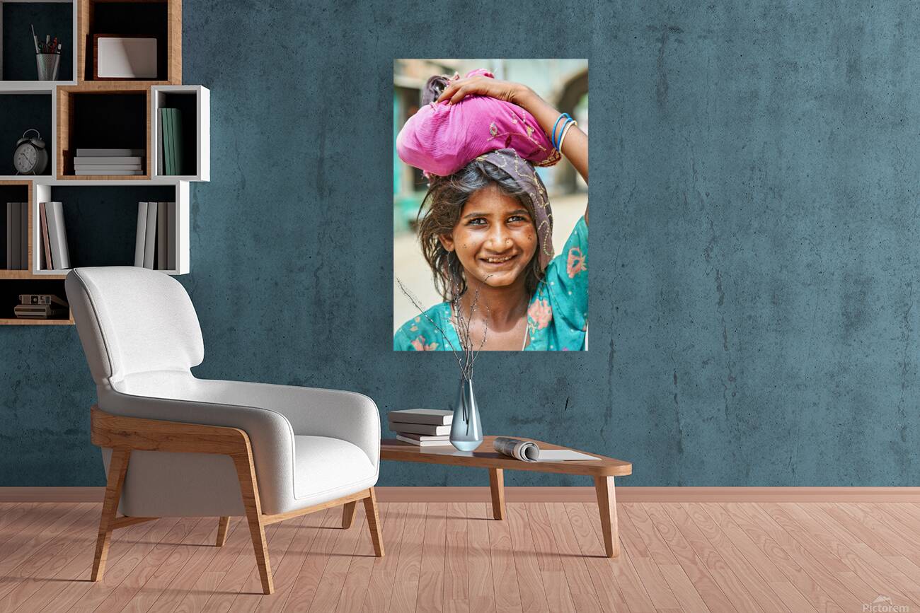 Portrait of a young girl carrying cloth in Mandawa Rajasthan Reproduction