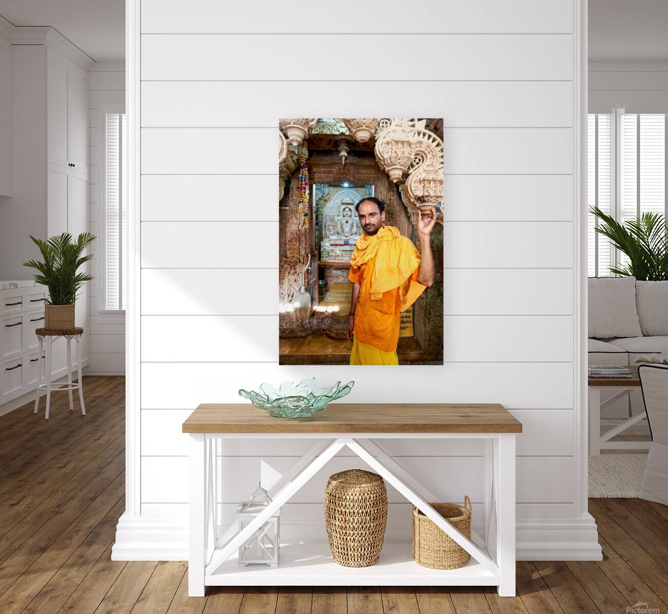 Hindu monk stands near statue in Jaisalmer Jain temple Reproduction