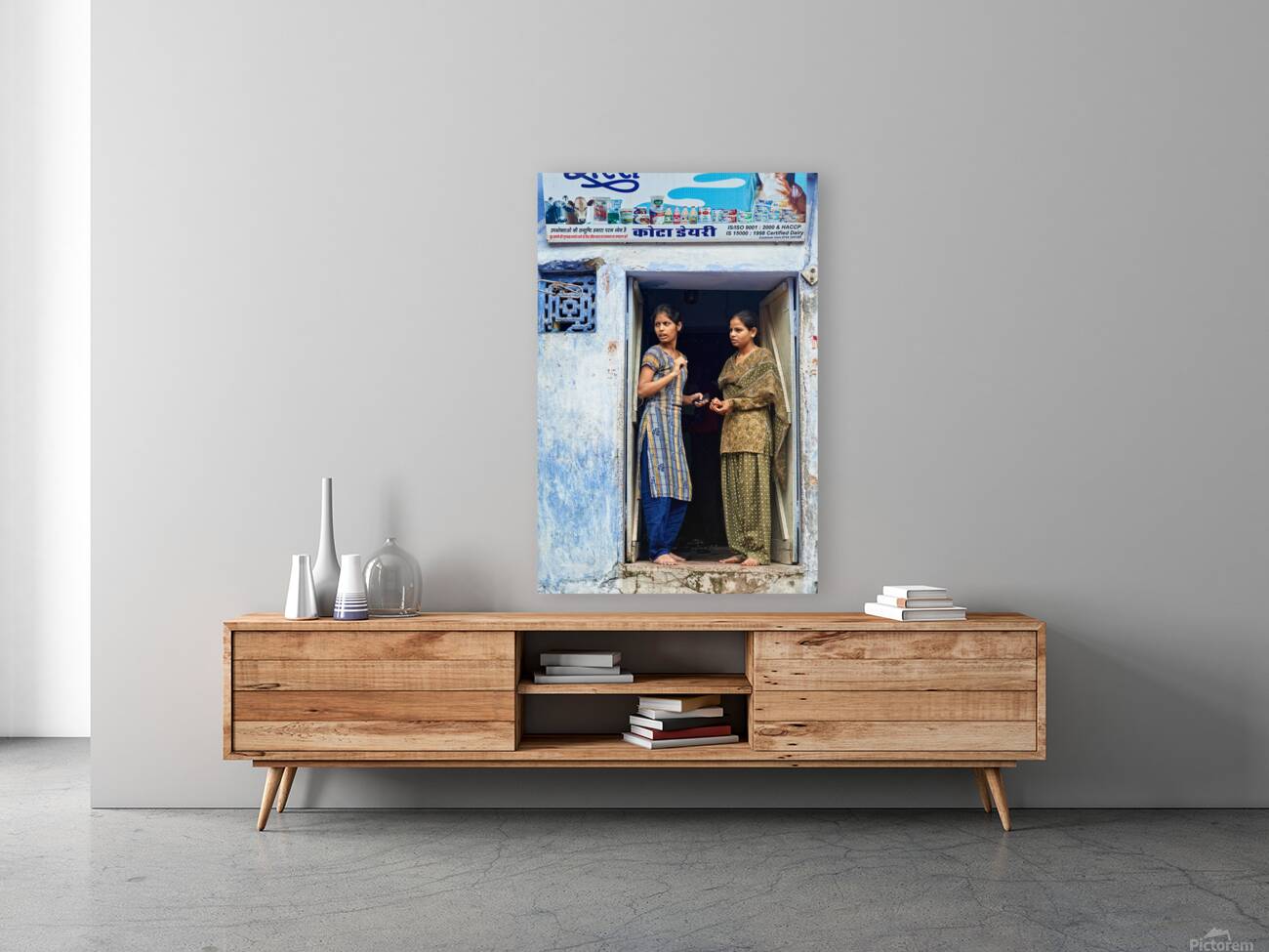 Women stand at their house door in Bundi Rajasthan Reproduction