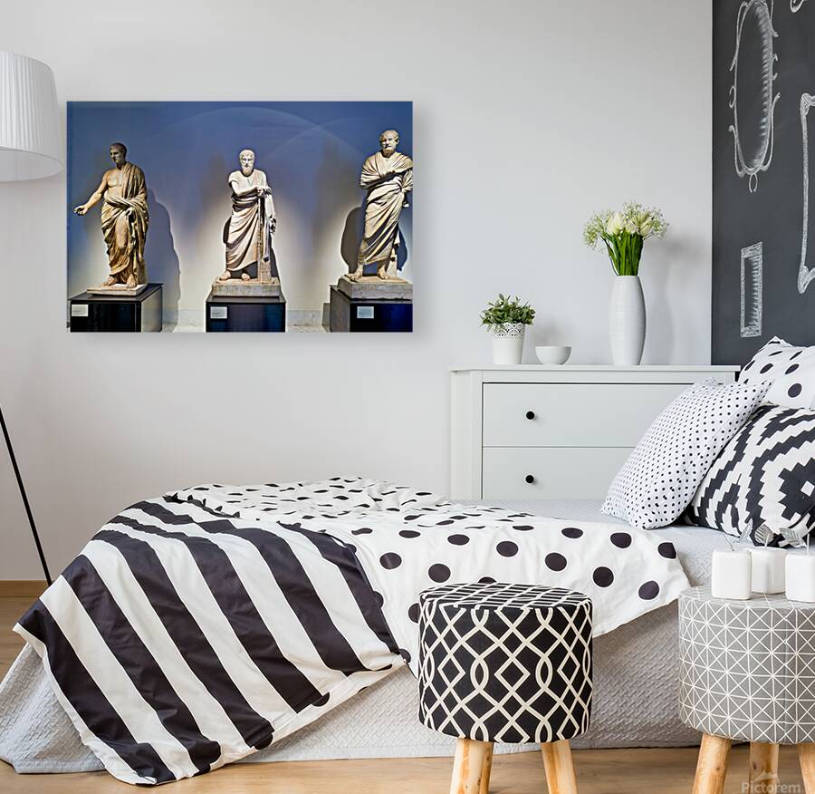 Statues of ancient philosophers displayed in museum setting Reproduction