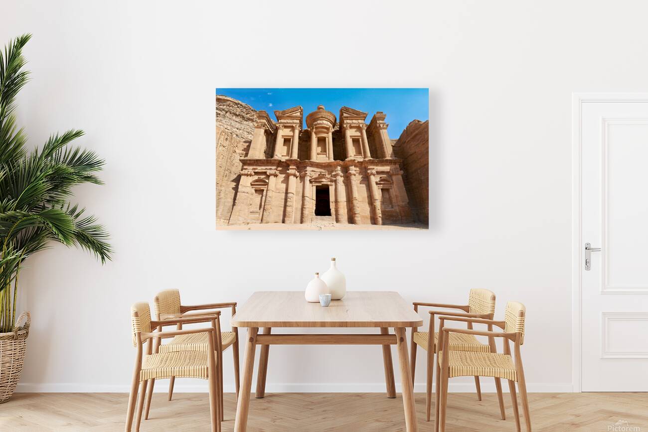 Visit to the Monastery at Petra in Jordan under clear blue sky Reproduction