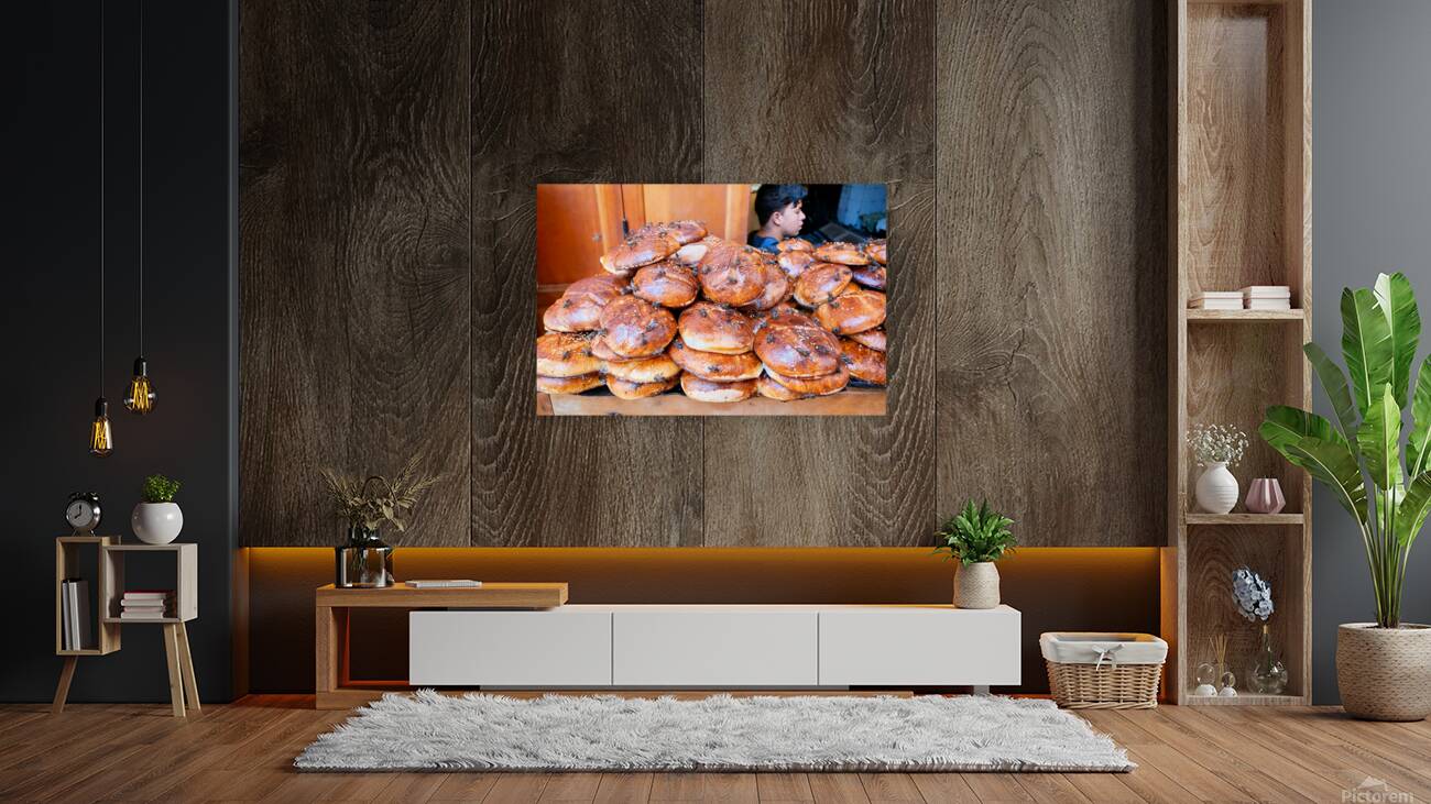 Loaf of bread covered in flies at market in Fez Morocco Reproduction