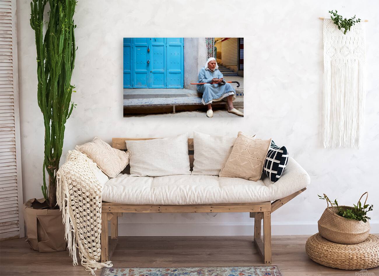 Portrait of a beggar sitting by a blue door in Fez Morocco Reproduction