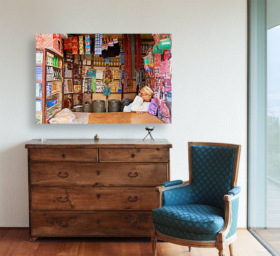 Grocer sleeping in shop in Marrakesh during afternoon hours Reproduction