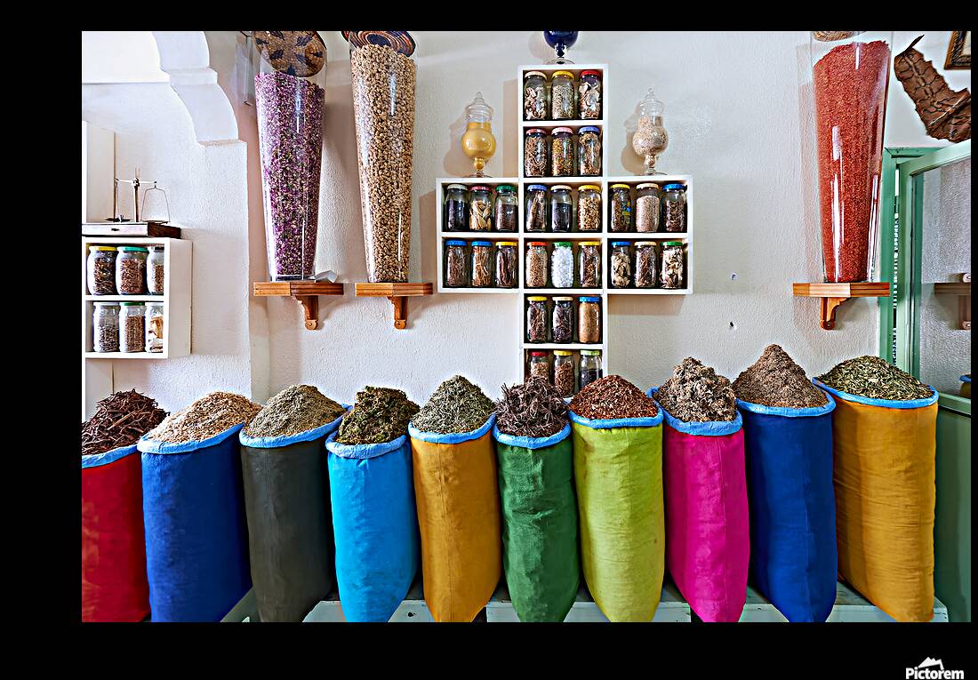 Herbal remedy shop in Marrakesh showing colorful bags of herbs Reproduction
