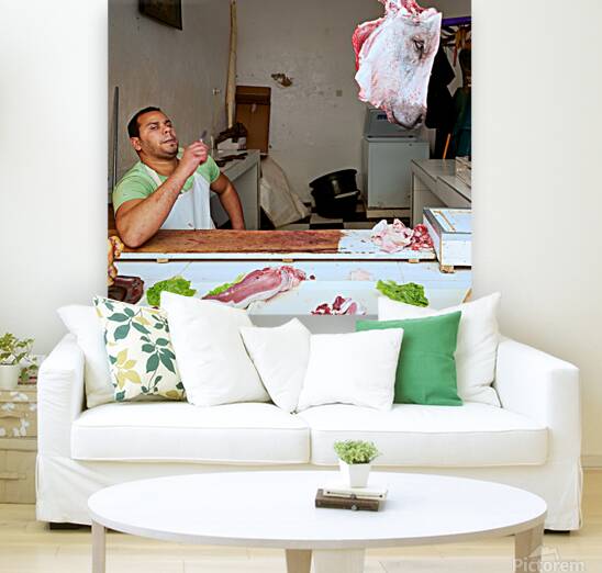 Butcher at work in Meknes souk showing fresh meat and livestock Reproduction