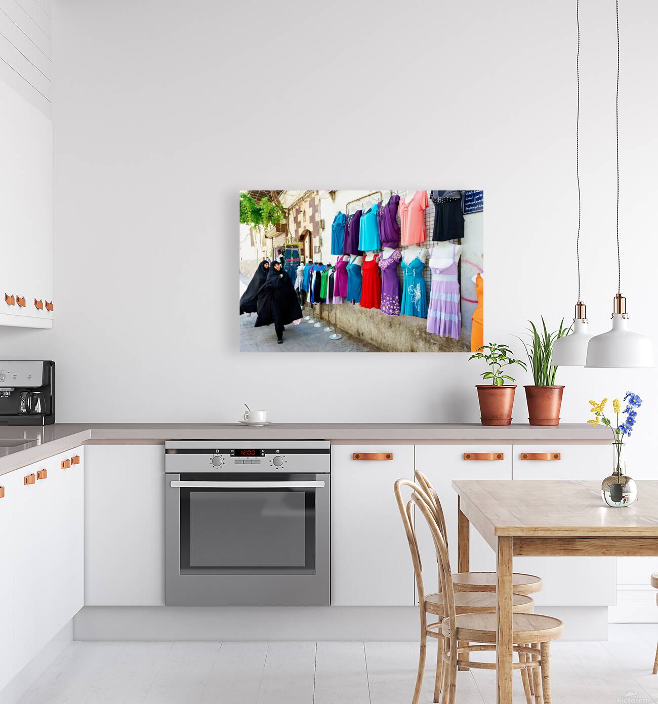 Women walk past colorful clothing displays in Damascus Syria Reproduction