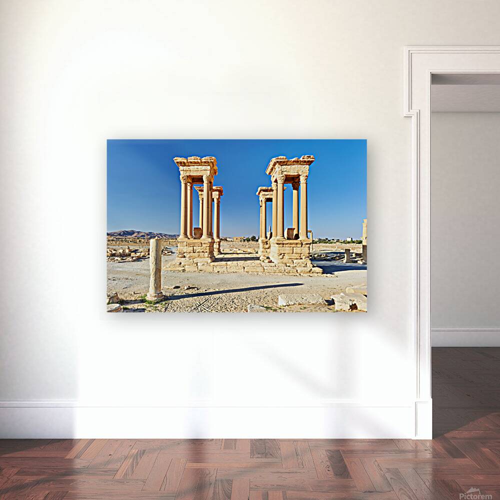 Exploring the Tetrapylon at Palmyra in Syria during the day Reproduction