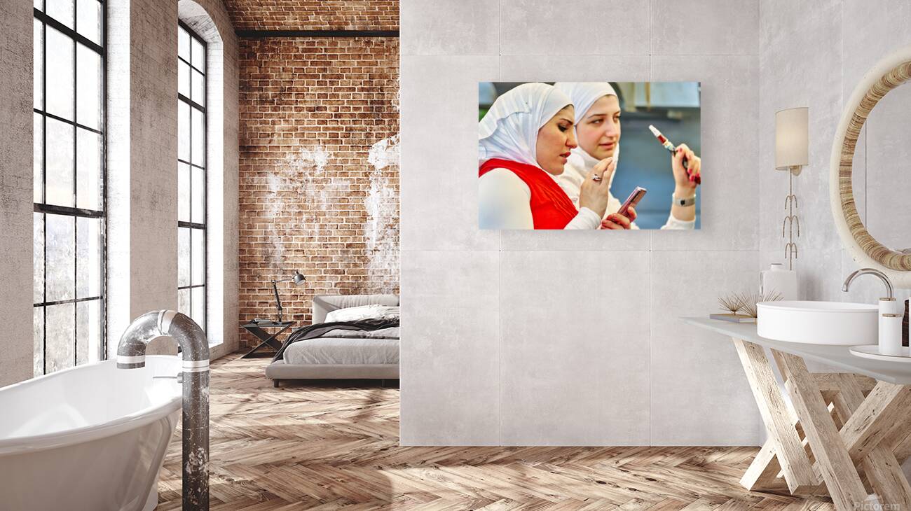 Young women enjoy hookah and talk on mobile phone in Aleppo Syri Reproduction